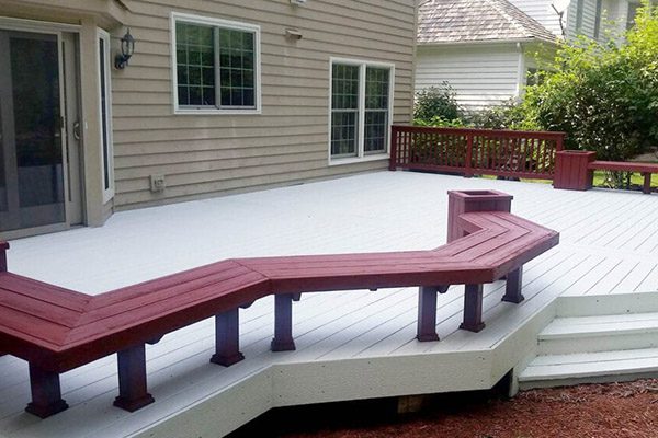 A deck with benches and a bench seat.