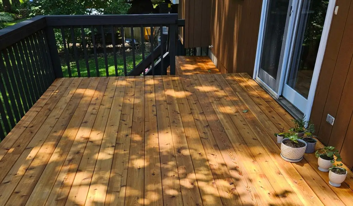 Freshly stained wood deck with clean surface, ready for summer gatherings on a Roselle home exterior.
